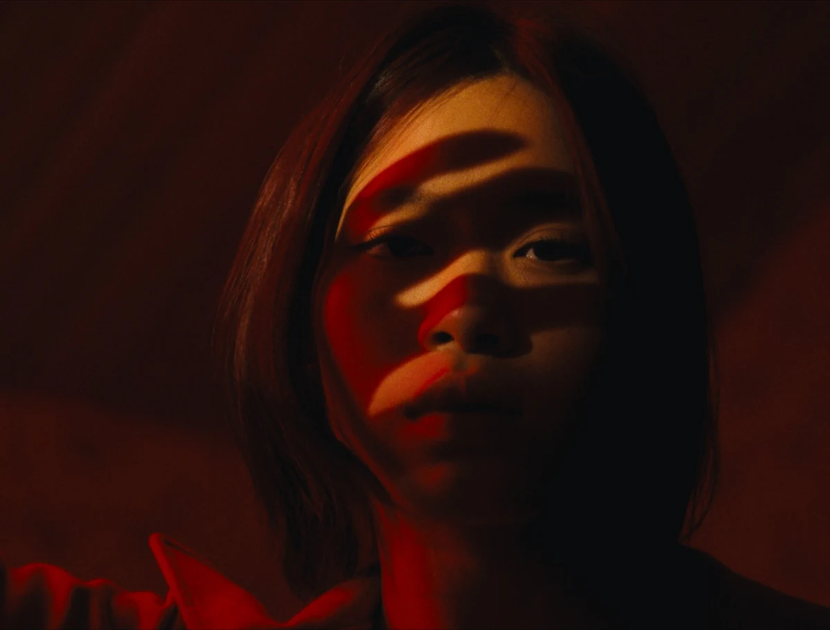 Girl with red shadows on her face
