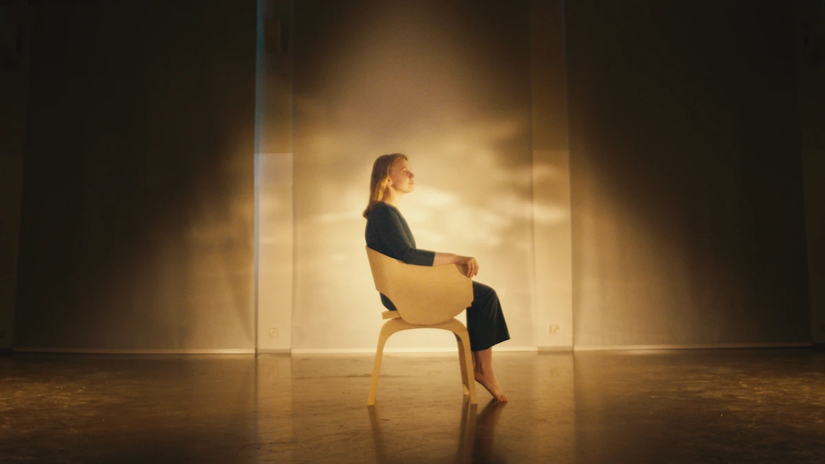 Girl in a chair with water reflections